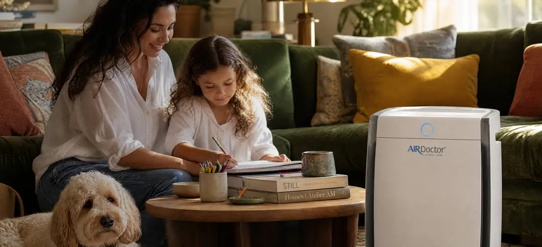 Family in a living room with an AirDoctor air purifier running