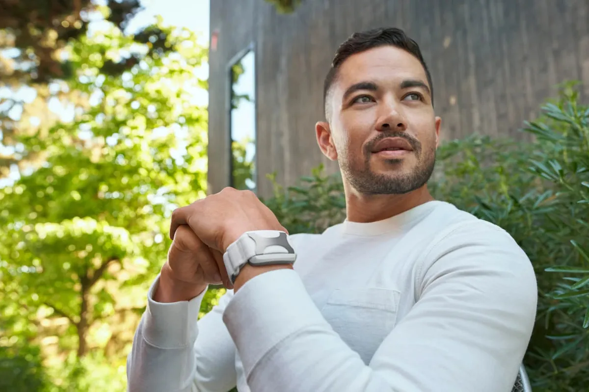 A man wearing the Apollo device on his wrist