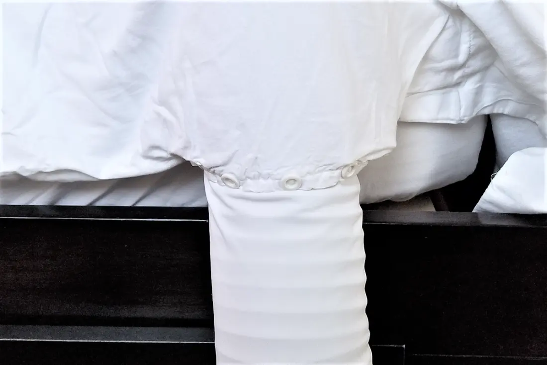 The BedJet air hose connecting into the Cloud Sheet at the side of a made bed.