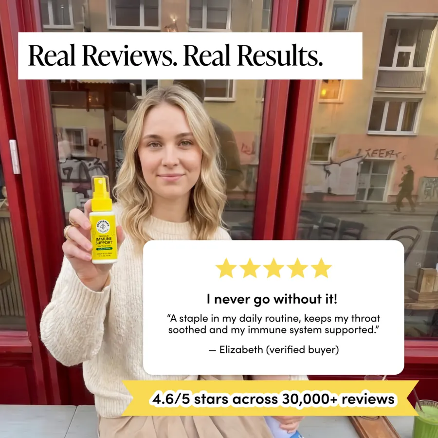 Customer holding the yellow throat spray bottle beside a five-star review card