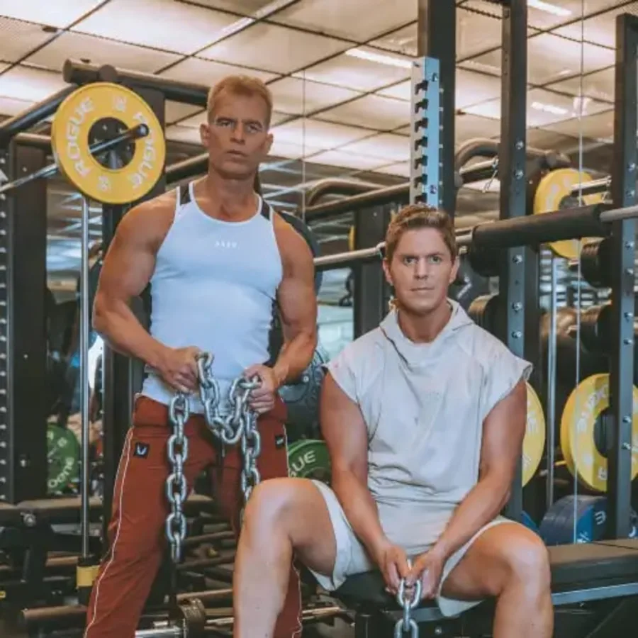 Wade Lightheart and Matt Gallant, the two founders of BiOptimizers, photographed in a gym with a heavy chain