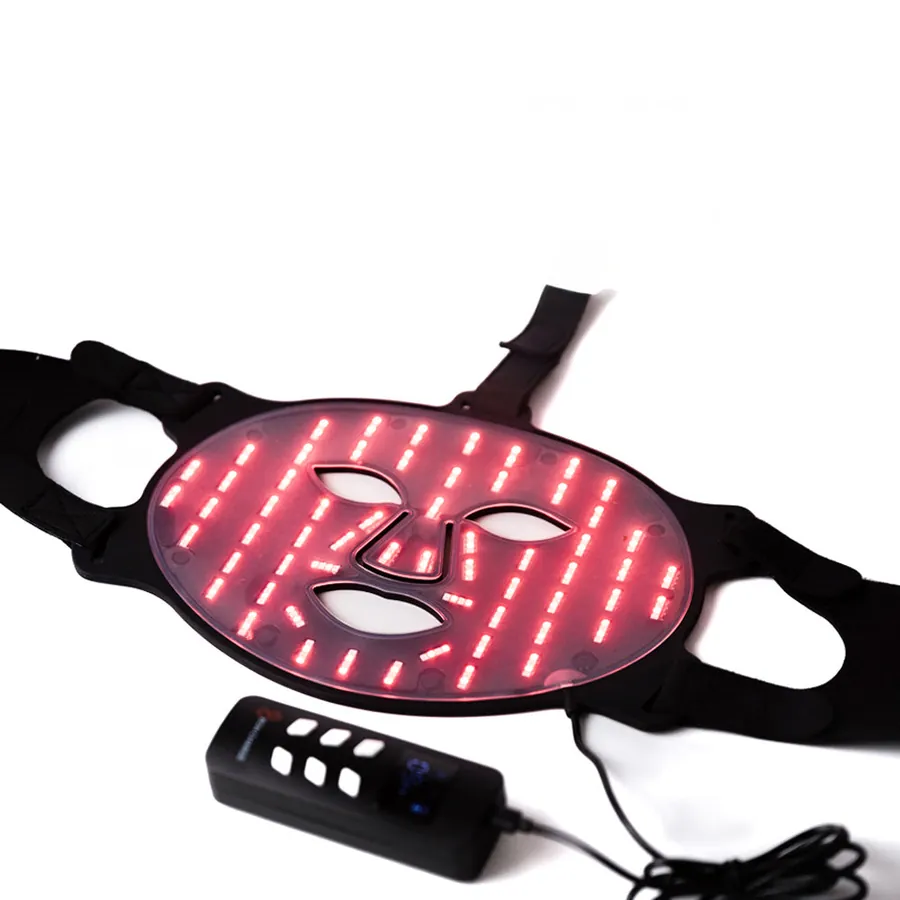 The BON CHARGE Red Light Face Mask lit, with its handheld controller