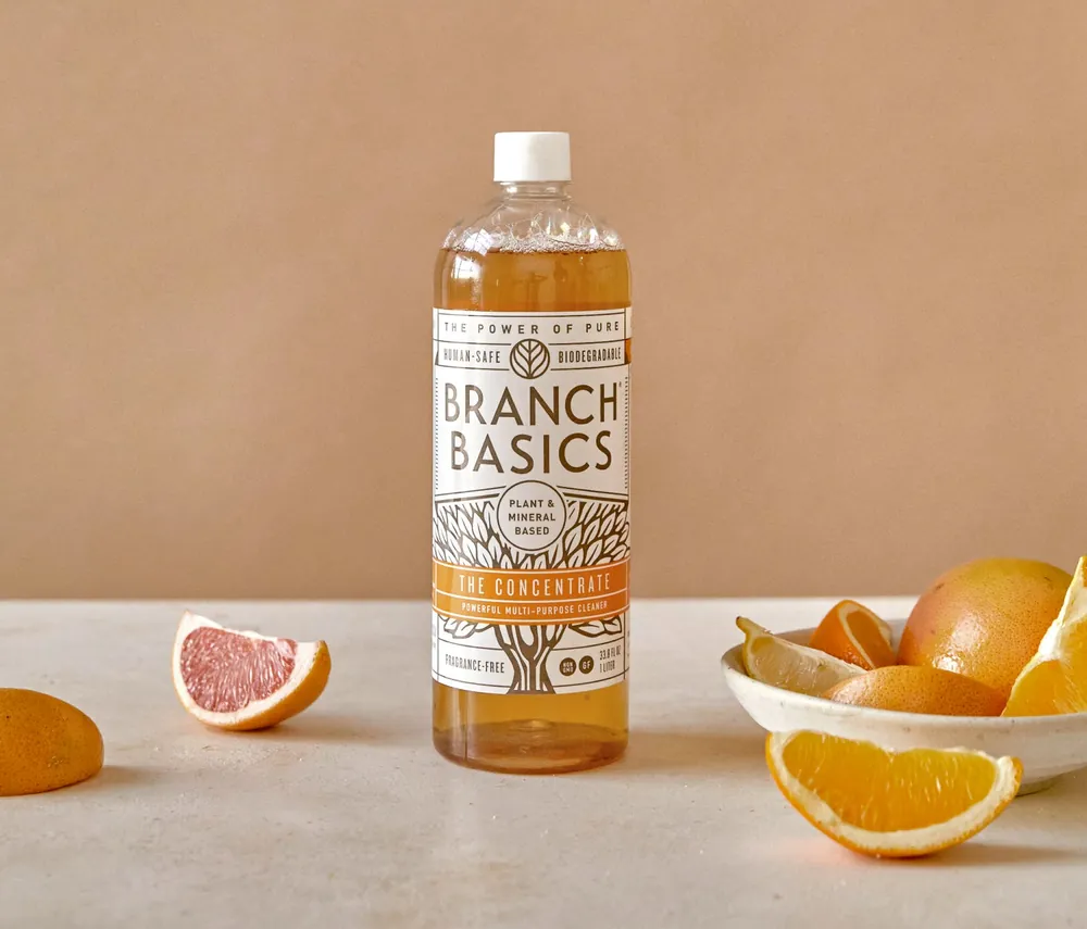 The Branch Basics Concentrate bottle, 33.8 fl oz, photographed with citrus