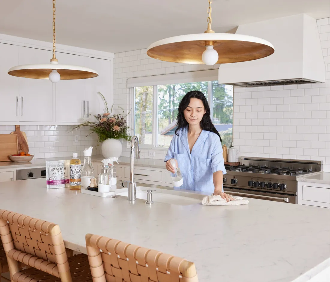 A kitchen counter with Branch Basics bottles in daily use
