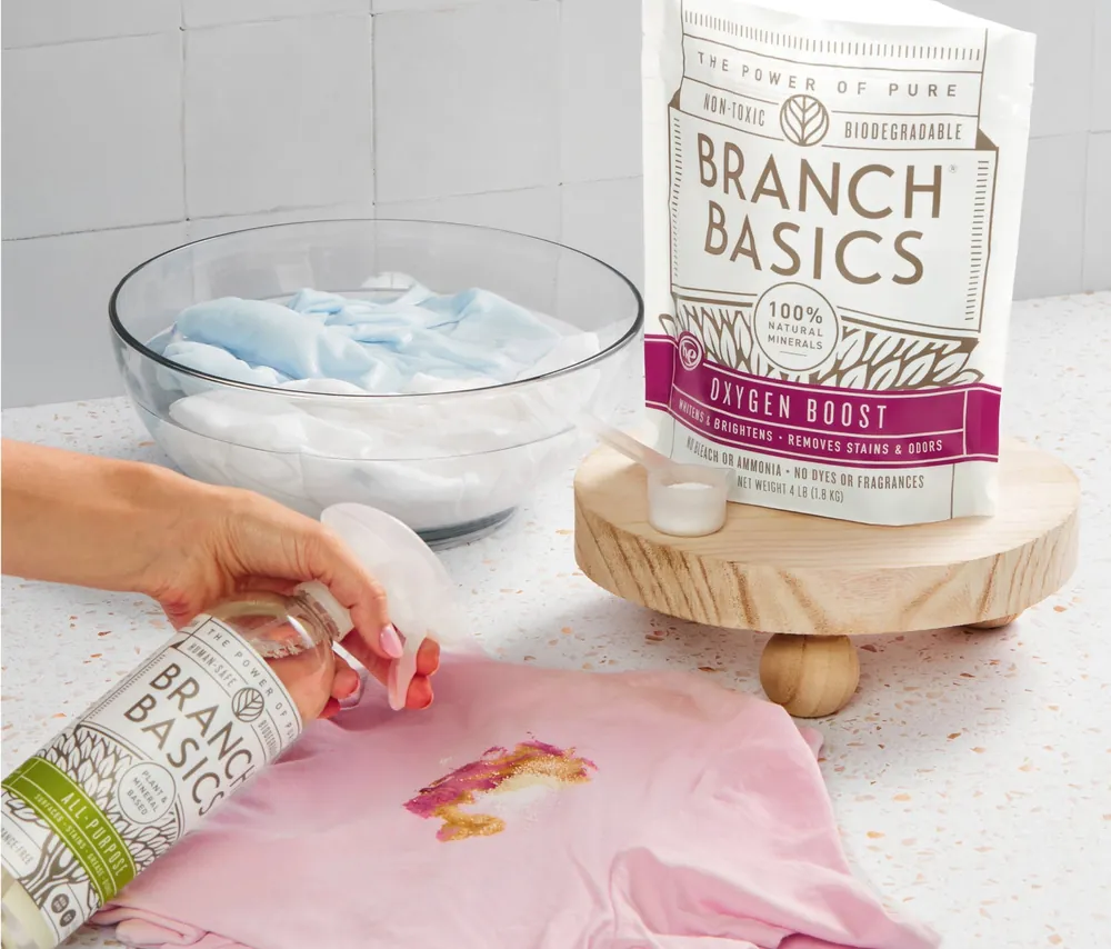 Treating a stain on a child's shirt with concentrate and Oxygen Boost powder