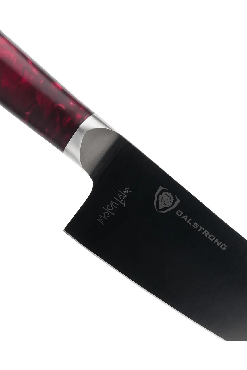 Close up of the black coated blade and polished bolster of the Spartan Ghost chef knife
