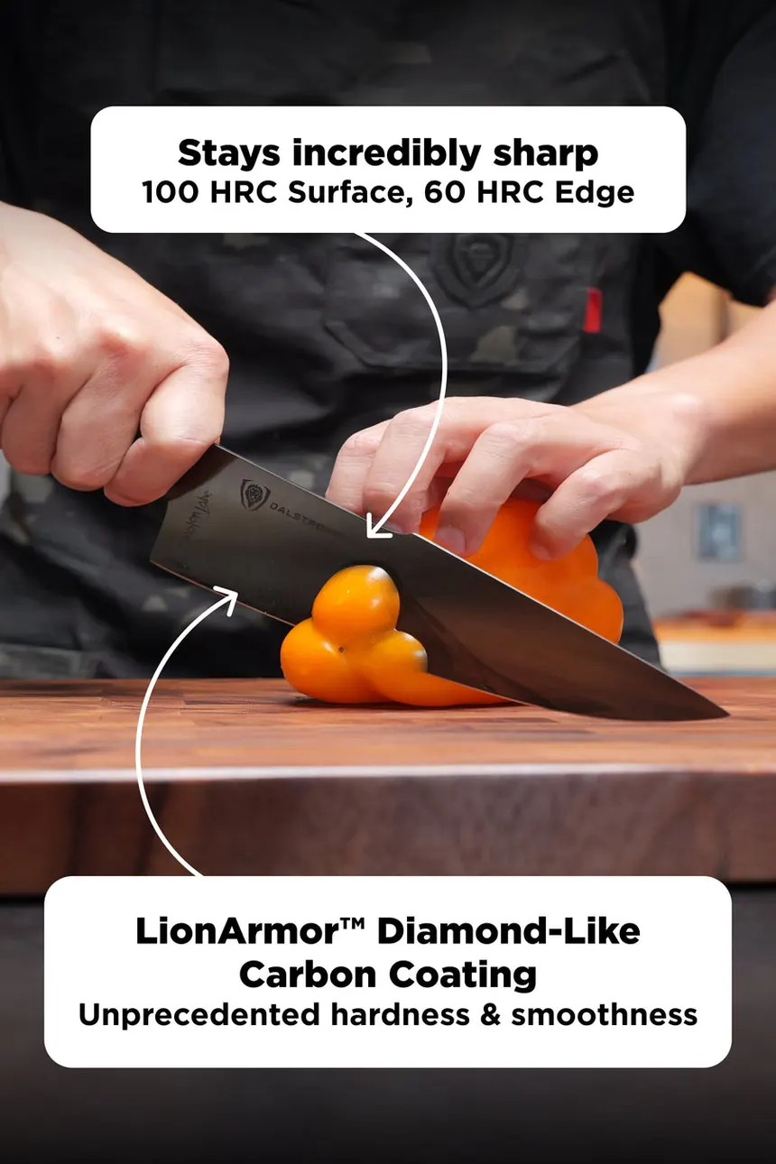 A cook slicing yellow peppers on a wooden board with the Spartan Ghost chef knife