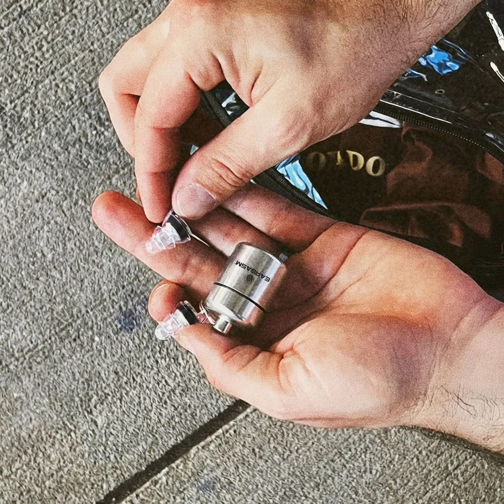 Hands opening the aluminum Eargasm carrying case