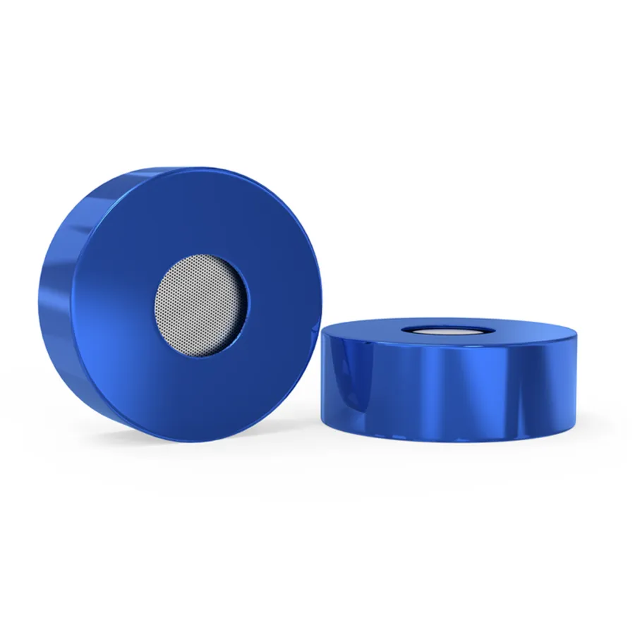 An Eargasm attenuation filter next to its aluminum case