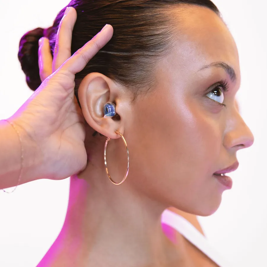 A model wearing a blue high fidelity earplug