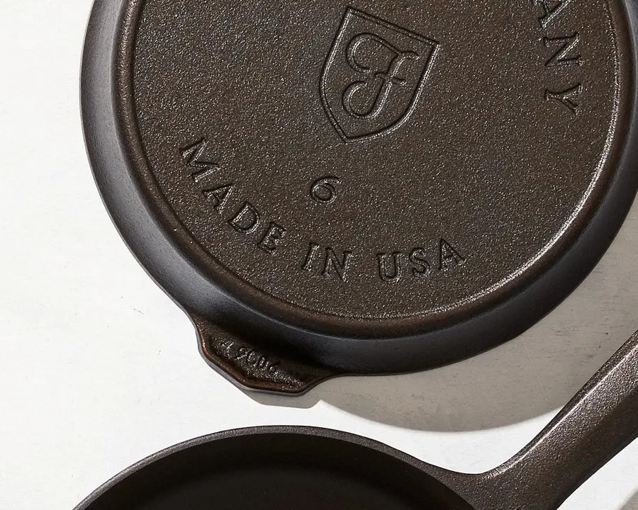 The underside of a Field skillet showing the cast date code stamped near the helper handle