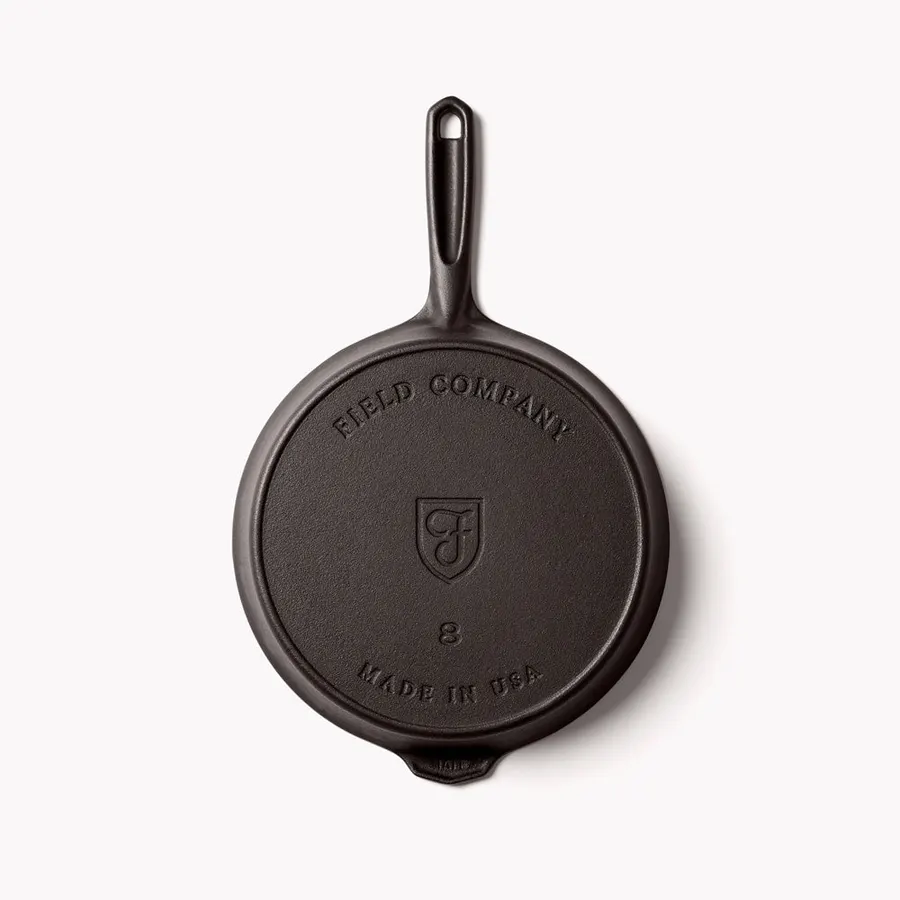 The underside of a Field skillet showing the maker's shield mark, the size number and Made in USA
