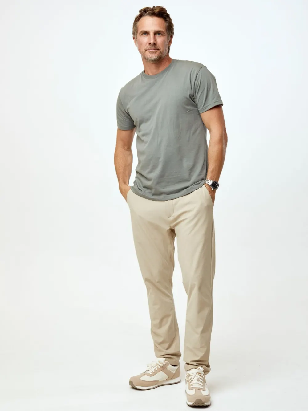 A man wearing the exclusive mercury green Fresh Clean Threads crew neck tee.
