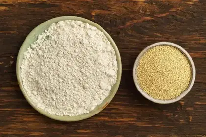 Bowls of plant protein powder and amaranth grain