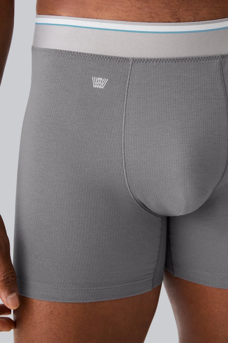 Close product photograph of the AIRKNITx Cotton boxer brief showing the fine mesh surface and the flyless front panel