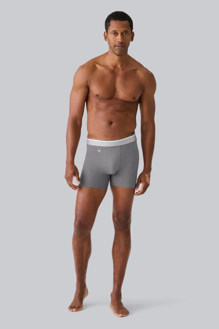 Man wearing grey AIRKNITx Cotton boxer briefs, full length product photograph