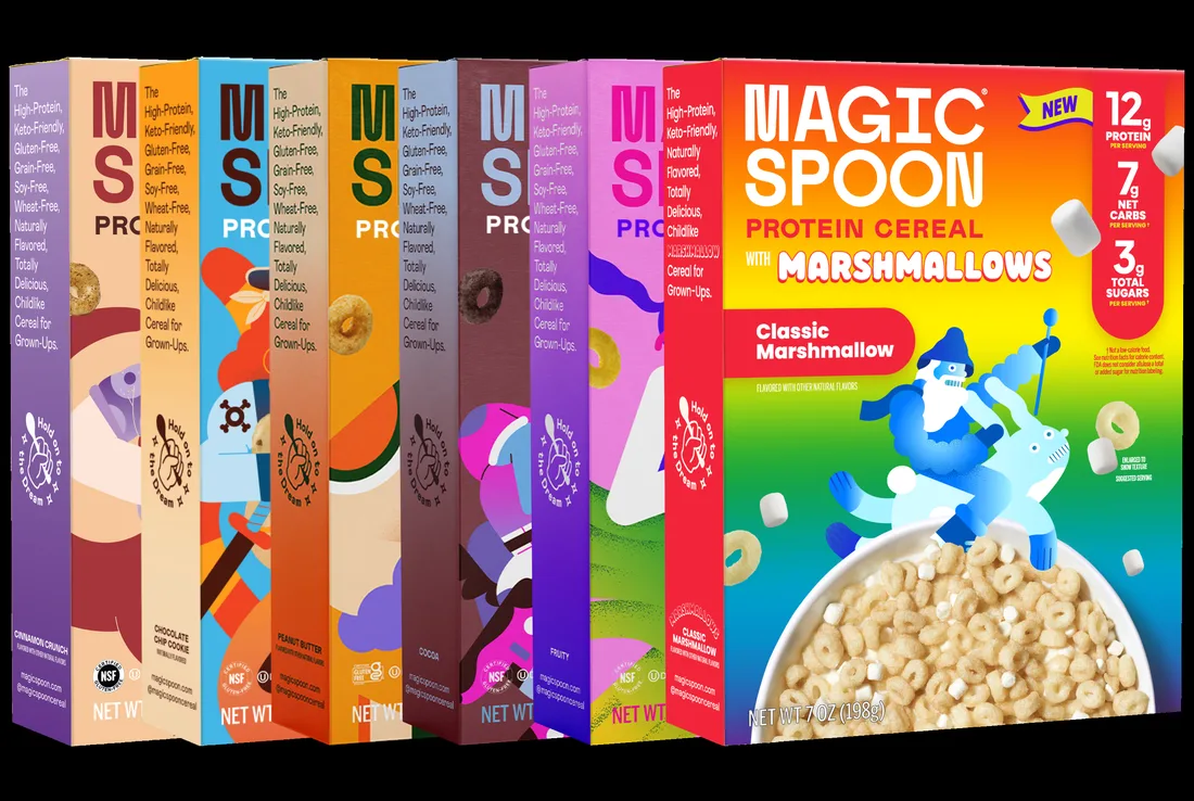 A row of Magic Spoon protein cereal boxes in different colors, with the Classic Marshmallow box at the front
