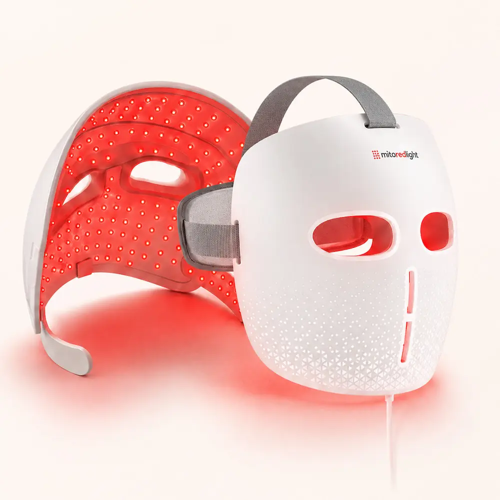 Two MitoGLOW masks side by side, one lit and one switched off