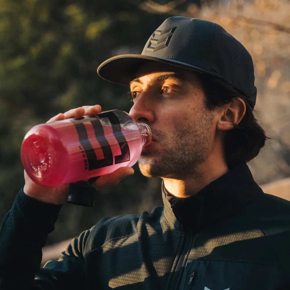 Drinking a bottle of mixed MTN OPS CALM outdoors at the end of the day