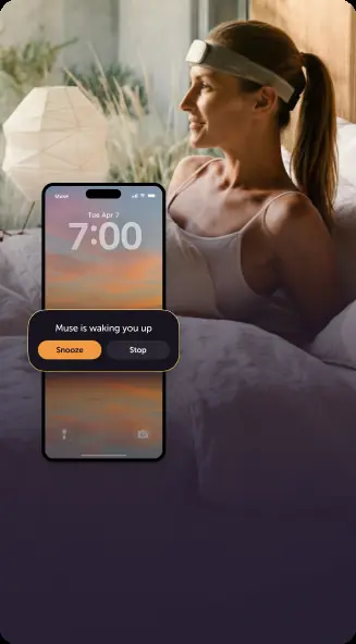 A phone showing the Muse app waking the sleeper at 7:00 inside the chosen alarm window