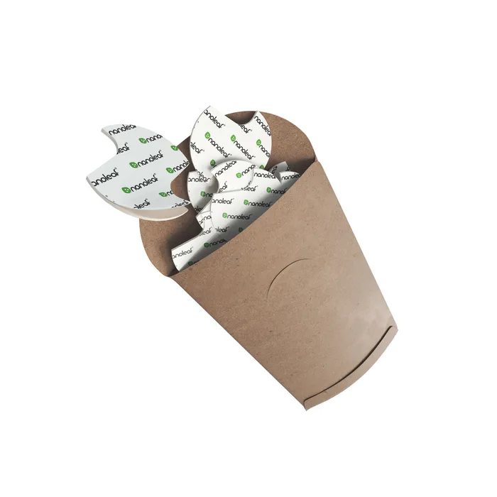 A small kraft sleeve holding a stack of white double sided Nanoleaf mounting tapes.