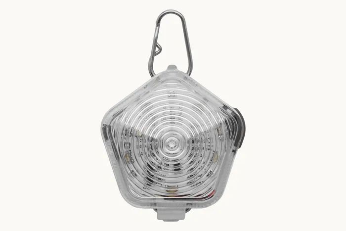 The Beacon safety light, switched off, showing its clear faceted shell