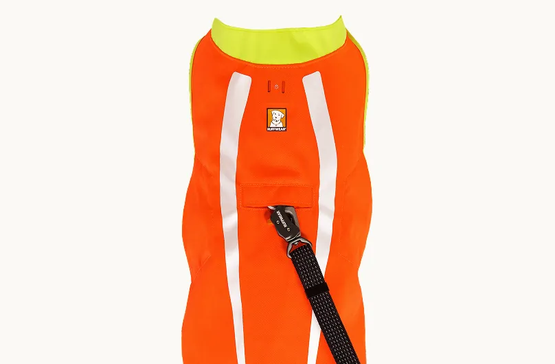 Top view of the Lumenglow vest with a leash clipped through the opening in the back panel