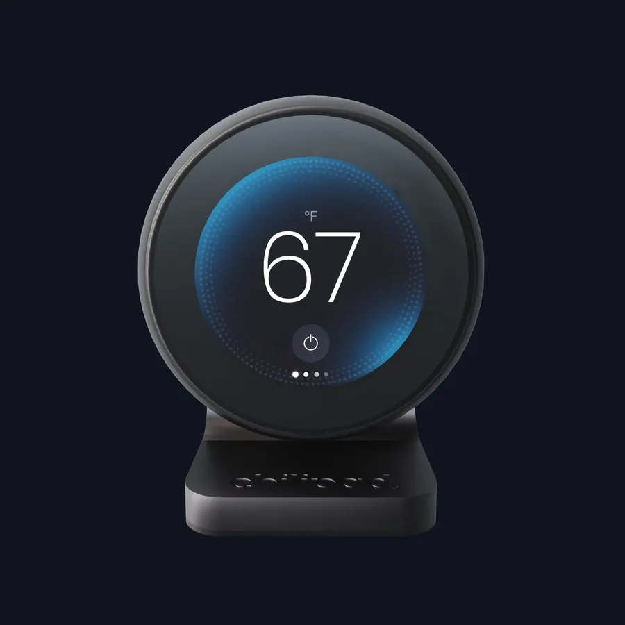 The Chilipad nightstand remote, a round dial with a low glow display reading 67 degrees