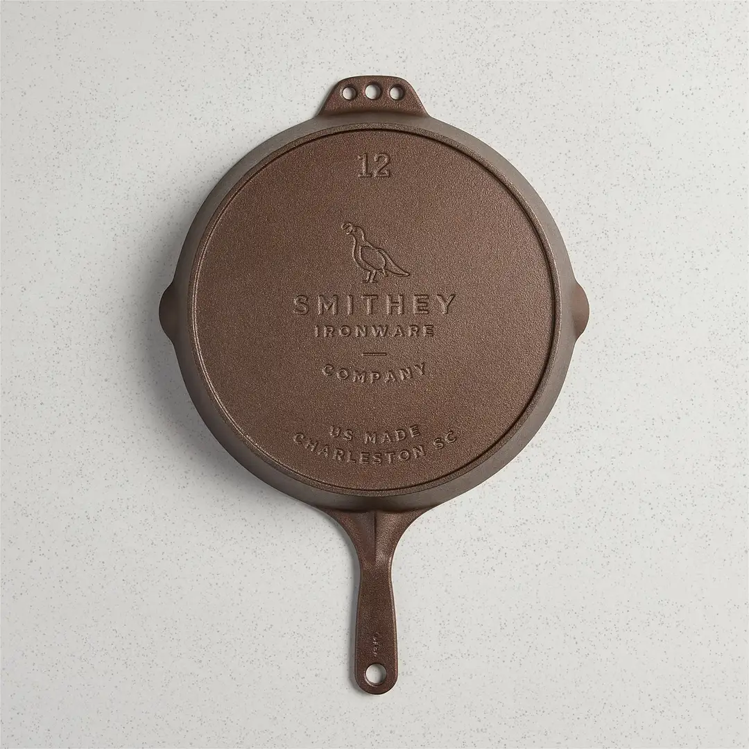 The underside of a Smithey skillet showing the raised maker mark and the size cast into the iron.