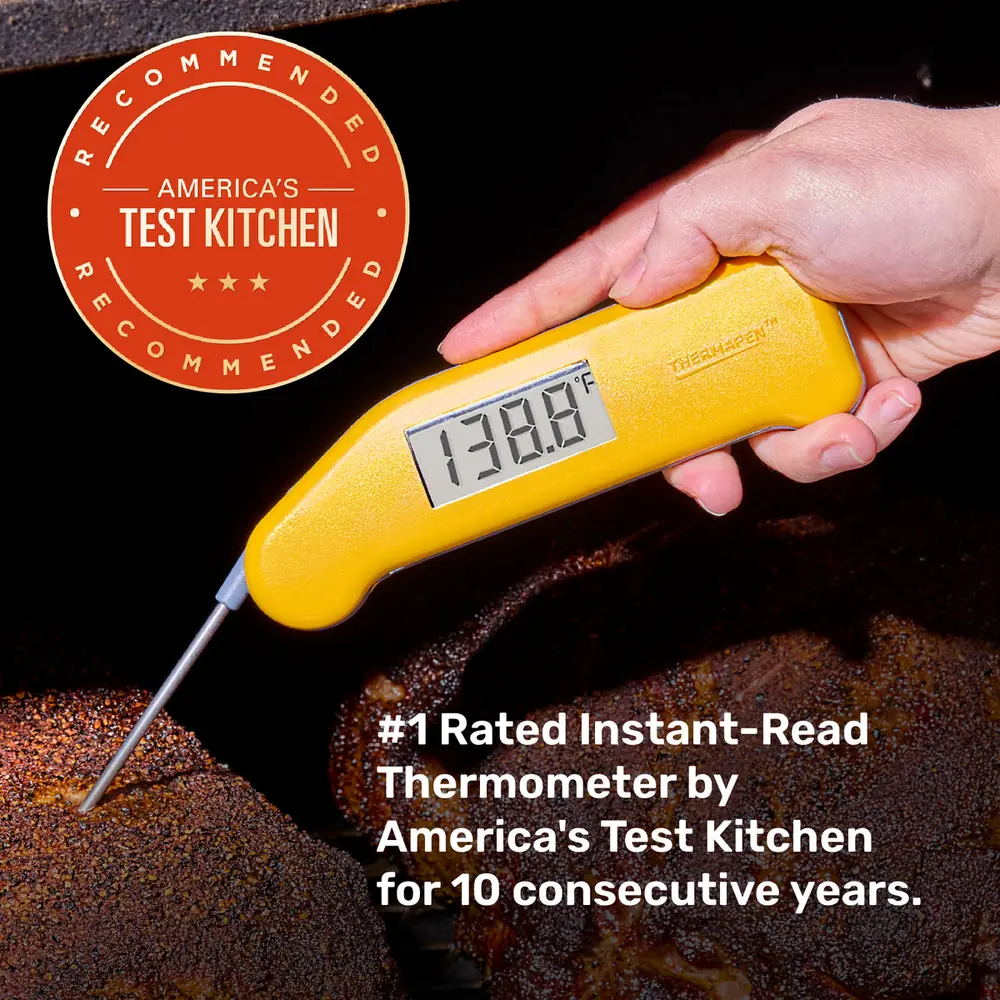 A yellow Classic Thermapen reading 138.8 degrees probing meat, with an America's Test Kitchen Recommended badge and the line about being the number one rated instant-read thermometer for ten consecutive years