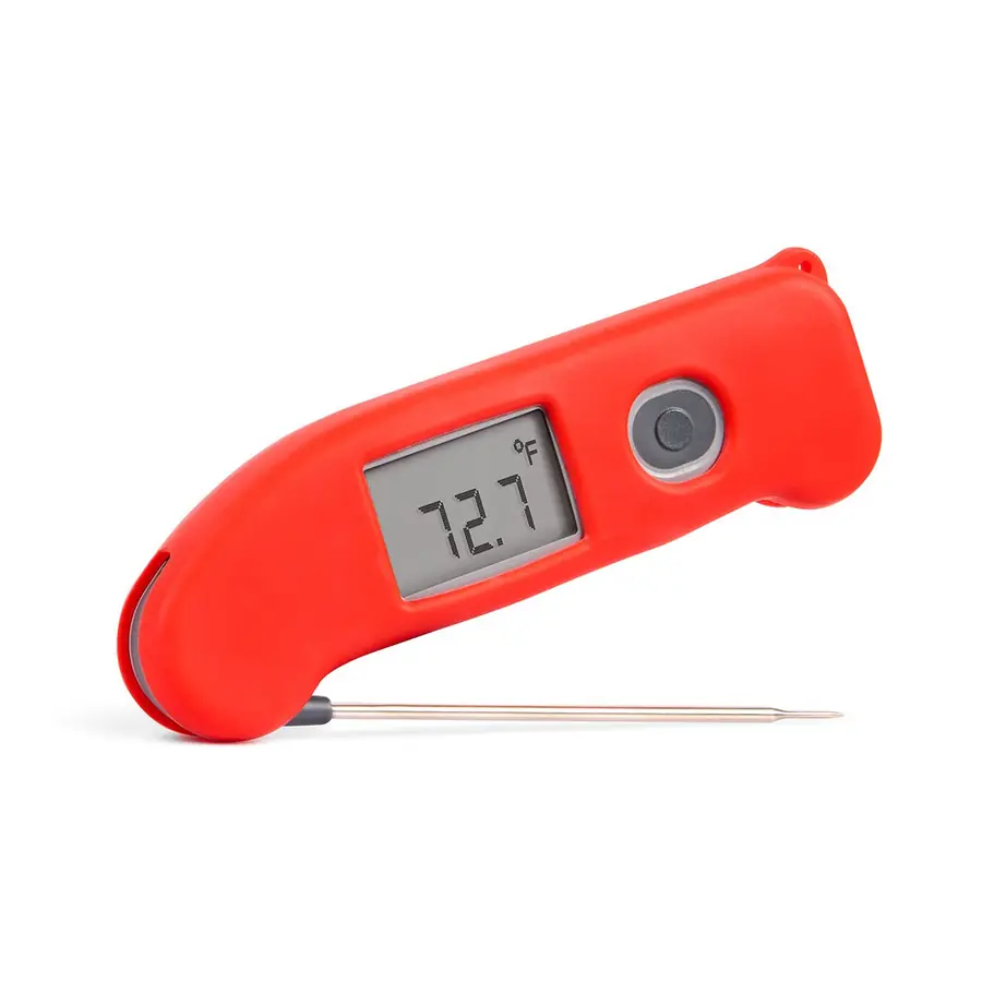 A red Thermapen ONE wearing its magnetic silicone protective boot, probe extended